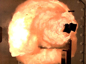 120223-N-ZZ999-001 DAHLGREN, Va. (Feb. 24, 2012) A high-speed camera captures the first full-energy shots from the Office of Naval Research-funded electromagnetic railgun prototype launcher that was recently installed at a test facility in Dahlgren, Va. The test shots begin a month-long series of full-energy tests to evaluate the first of two industry-built launchers that will help bring the Navy a step closer to producing a next-generation, long-range weapon for surface ships. The new launcher brings advanced material and high-power technologies in a system that now resembles a large-caliber gun. (U.S. Navy photo by John F. Williams/Released)